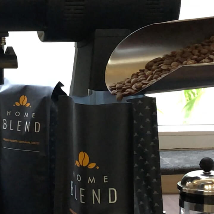 Home Blend Specialty Coffee Roasters Whole Beans 1 KG Being Filled