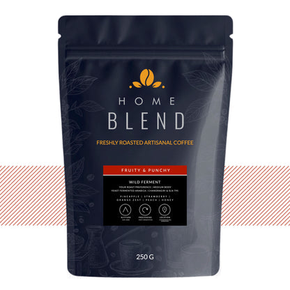 A 250g stand-up pouch of Home Blend coffee, featuring a dark navy blue design with gold and white text, and a red accent banner indicating 'Fruity & Punchy' flavor.