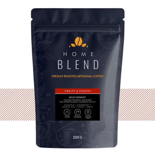 A 250g stand-up pouch of Home Blend coffee, featuring a dark navy blue design with gold and white text, and a red accent banner indicating 'Fruity & Punchy' flavor.