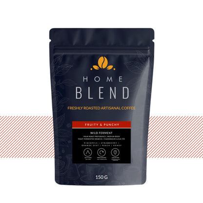 A 150g stand-up pouch of Home Blend Artisanal Coffee, Fruity & Punchy flavor, on a white background with a decorative red and white striped horizontal banner behind the package.